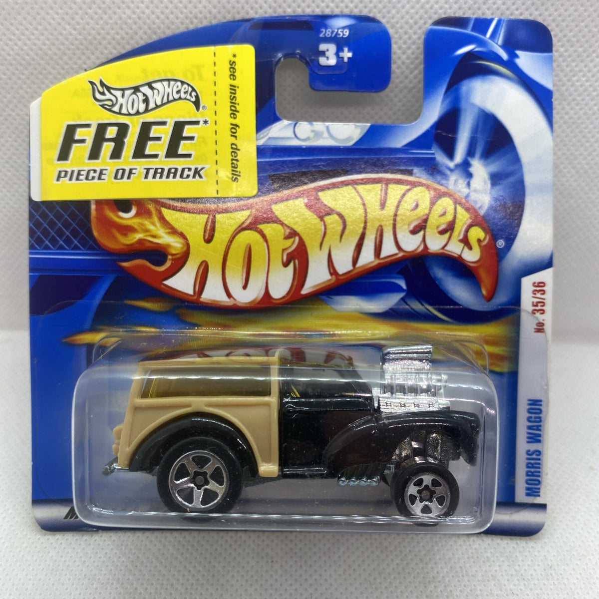 Black and tan die-cast Morris Wagon toy in Hot Wheels blister card, 2001