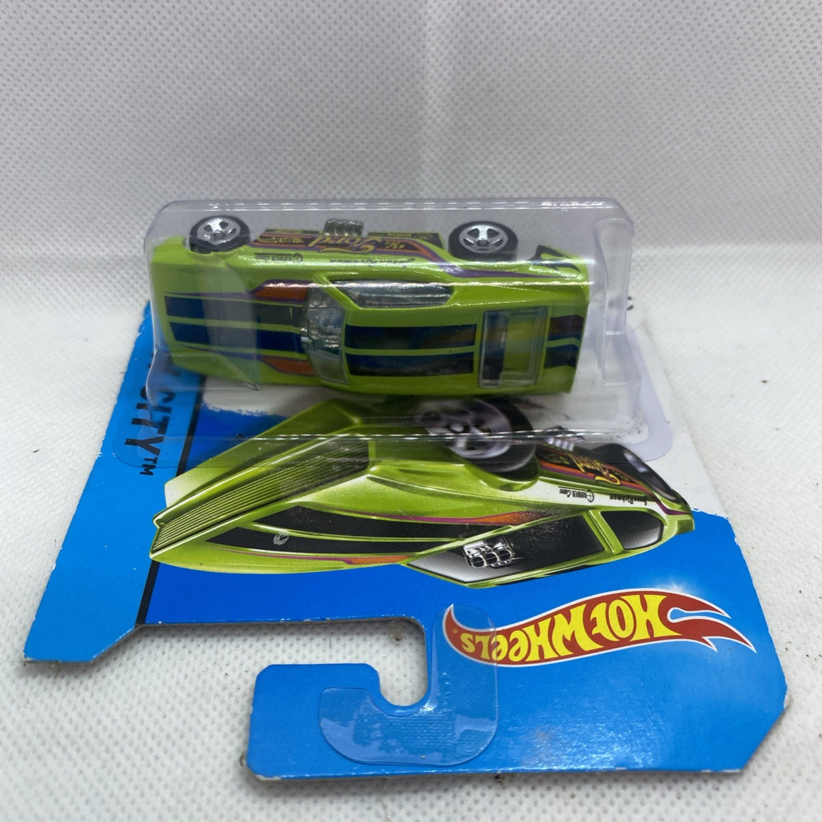 Hot Wheels die-cast toy car in clear blister tray, lime green with Ford stripe graphics