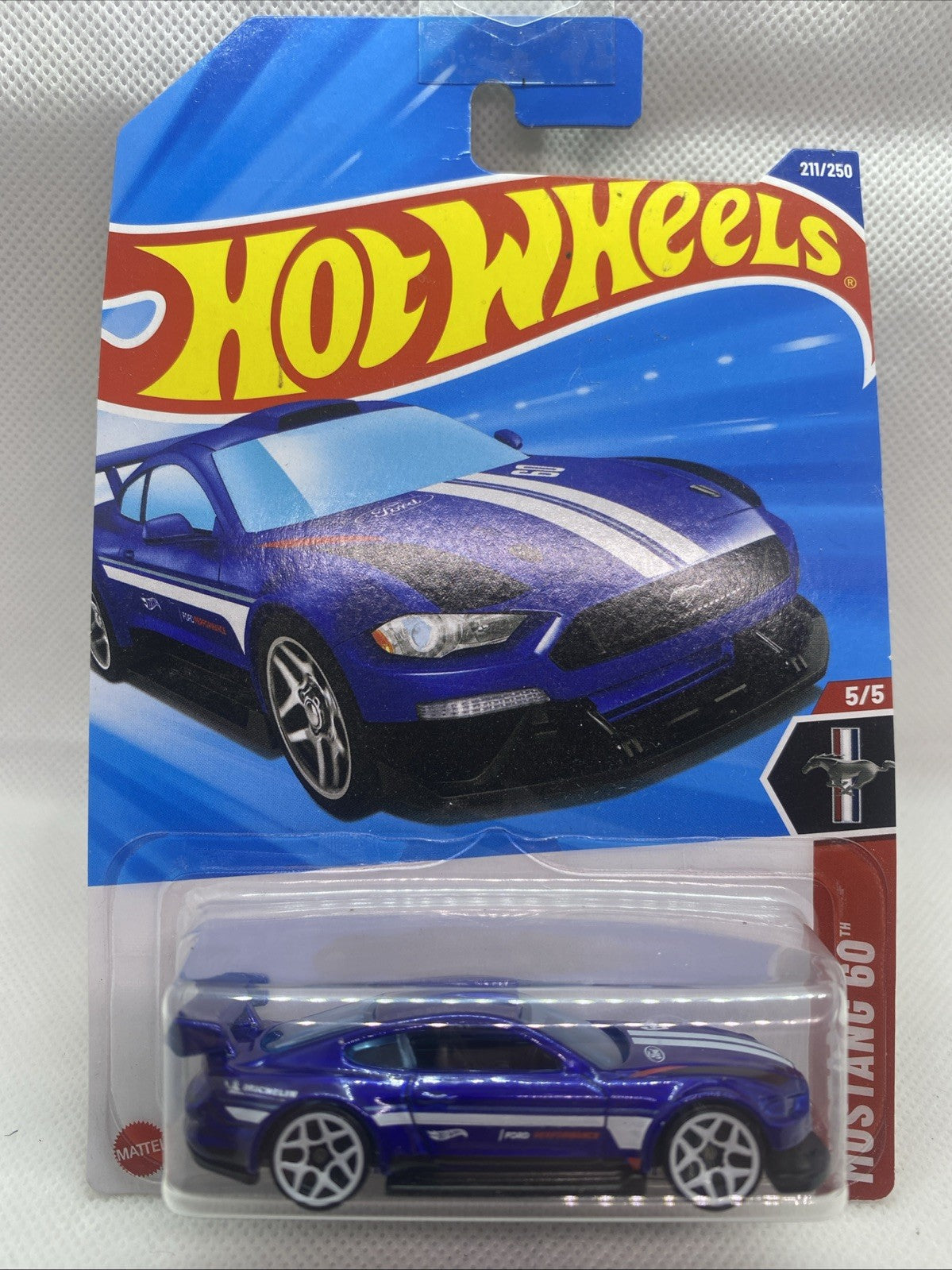 Hot Wheels die-cast car in sealed blue blister pack on short card