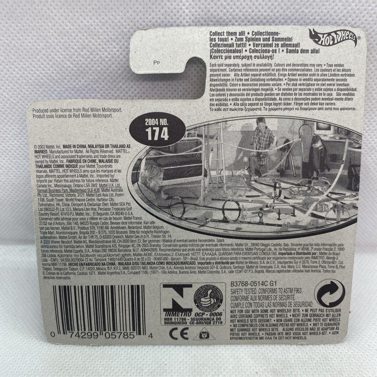 Hot Wheels car blister back card with product details, barcode, and age marking