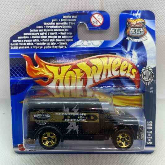 Hot Wheels armored truck die-cast in sealed blue blister card, black with yellow accents