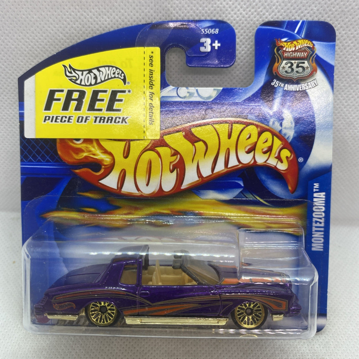 Hot Wheels metallic purple die-cast car in clear blister card, front view