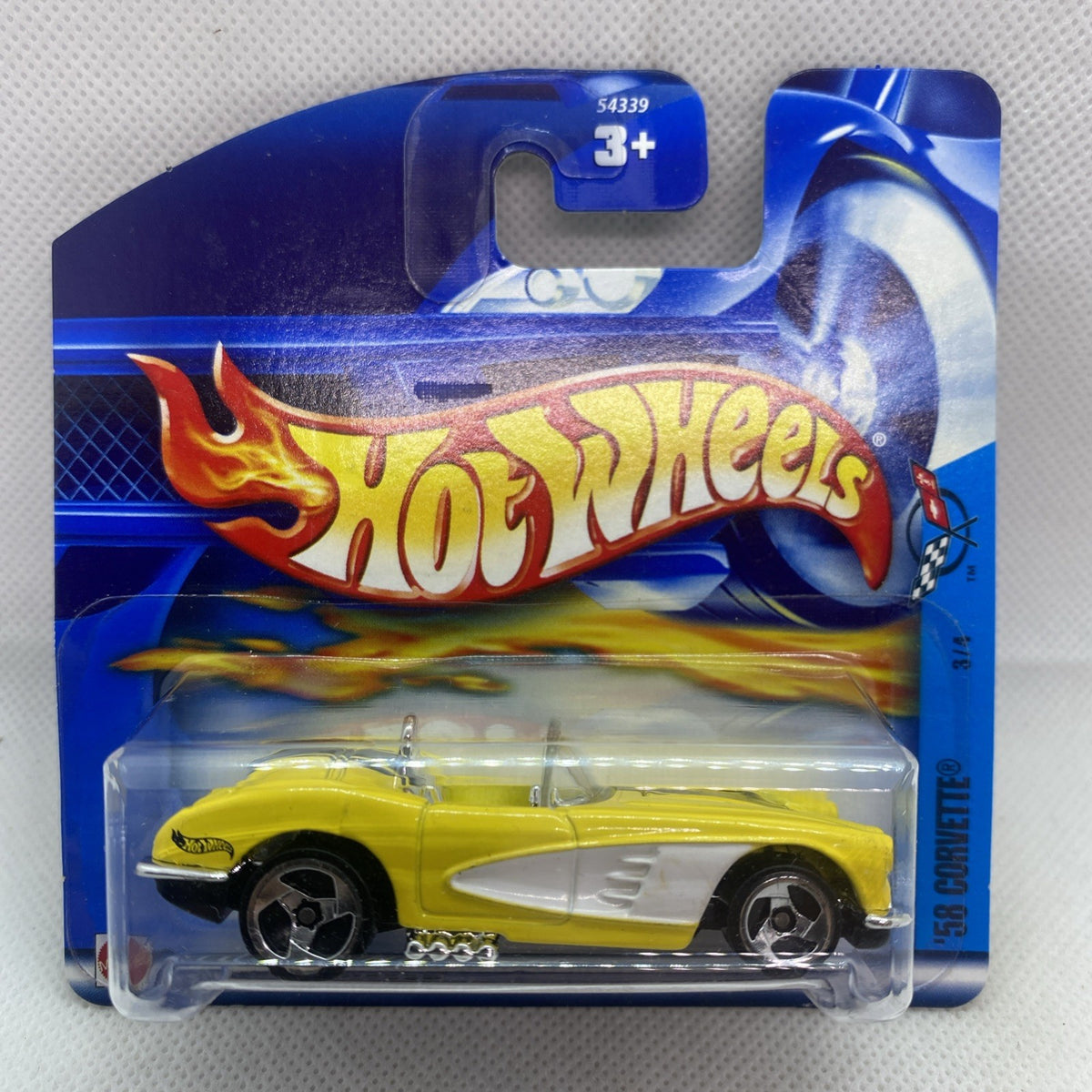 Hot Wheels 2002 Corvette #069 die-cast, yellow car in blue sealed blister card