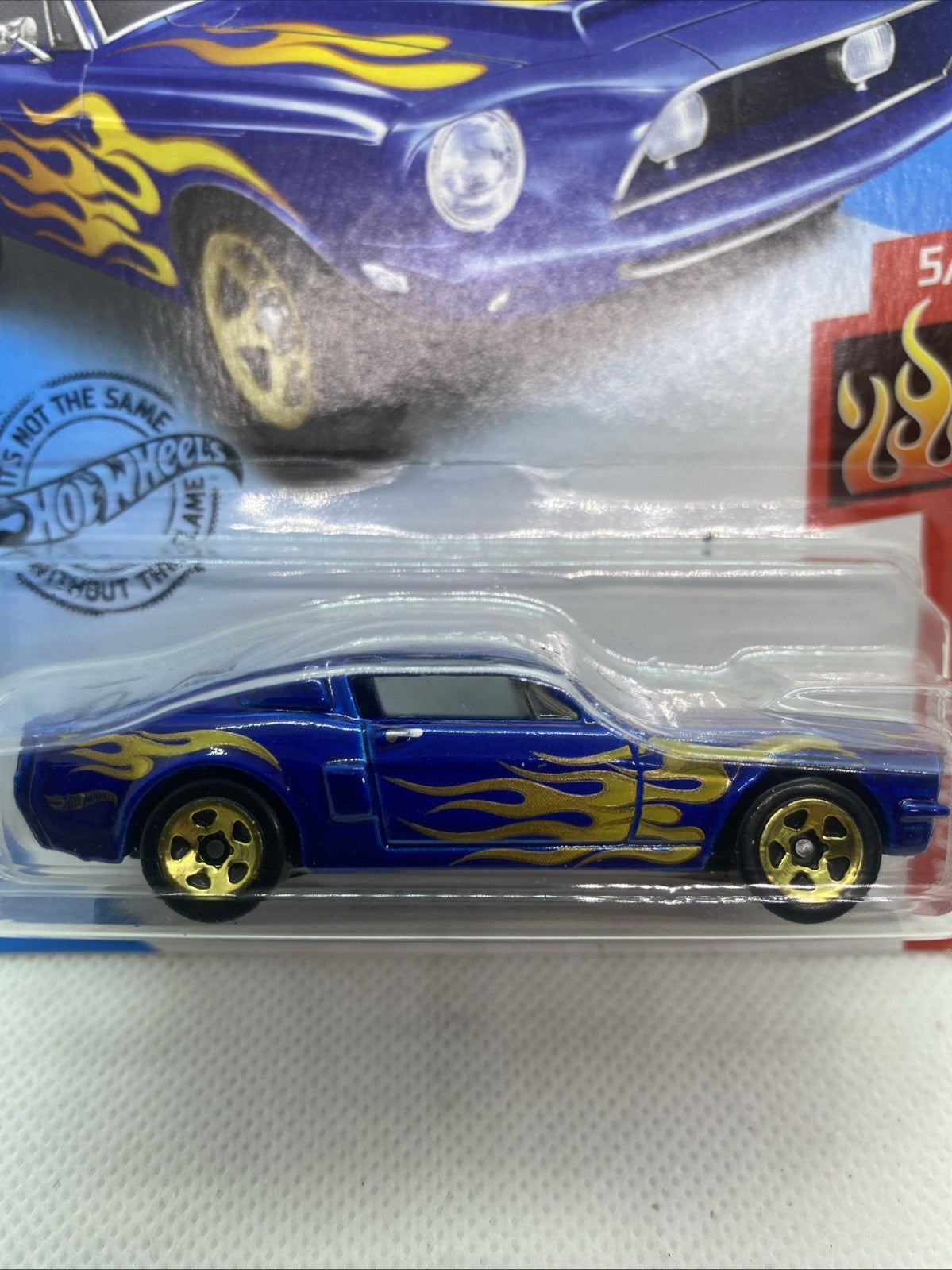 Close-up of Hot Wheels '68 Shelby GT500 HW Flames blue die-cast car