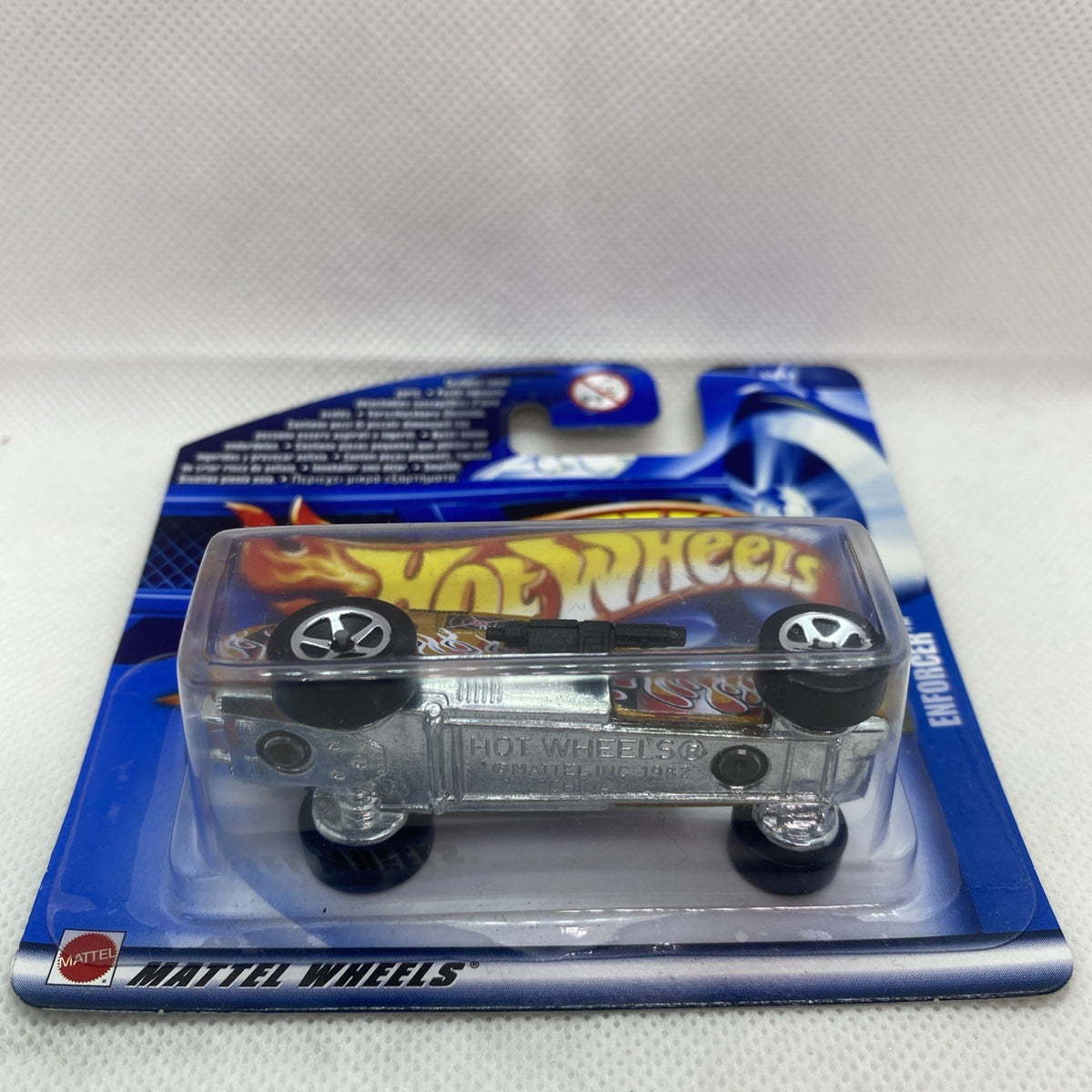 Hot Wheels Enforcer die-cast car blister pack, angled view, black wheels visible