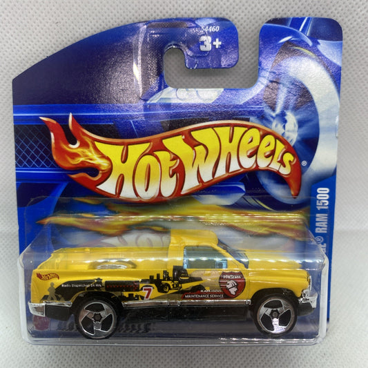 Hot Wheels die-cast Dodge Ram 1500 toy in clear blister card, yellow and black.