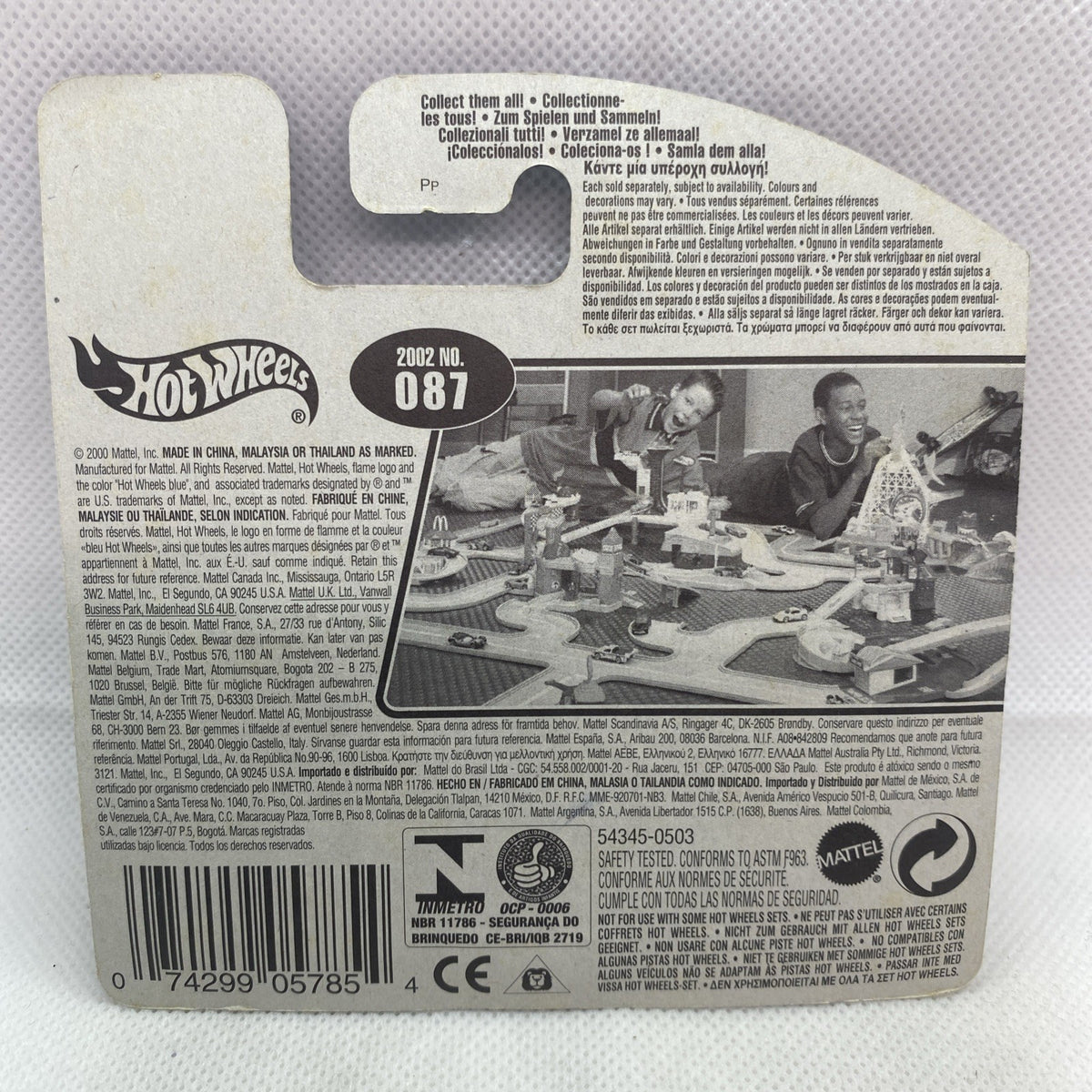 Back of card packaging with product details and barcode for green race car