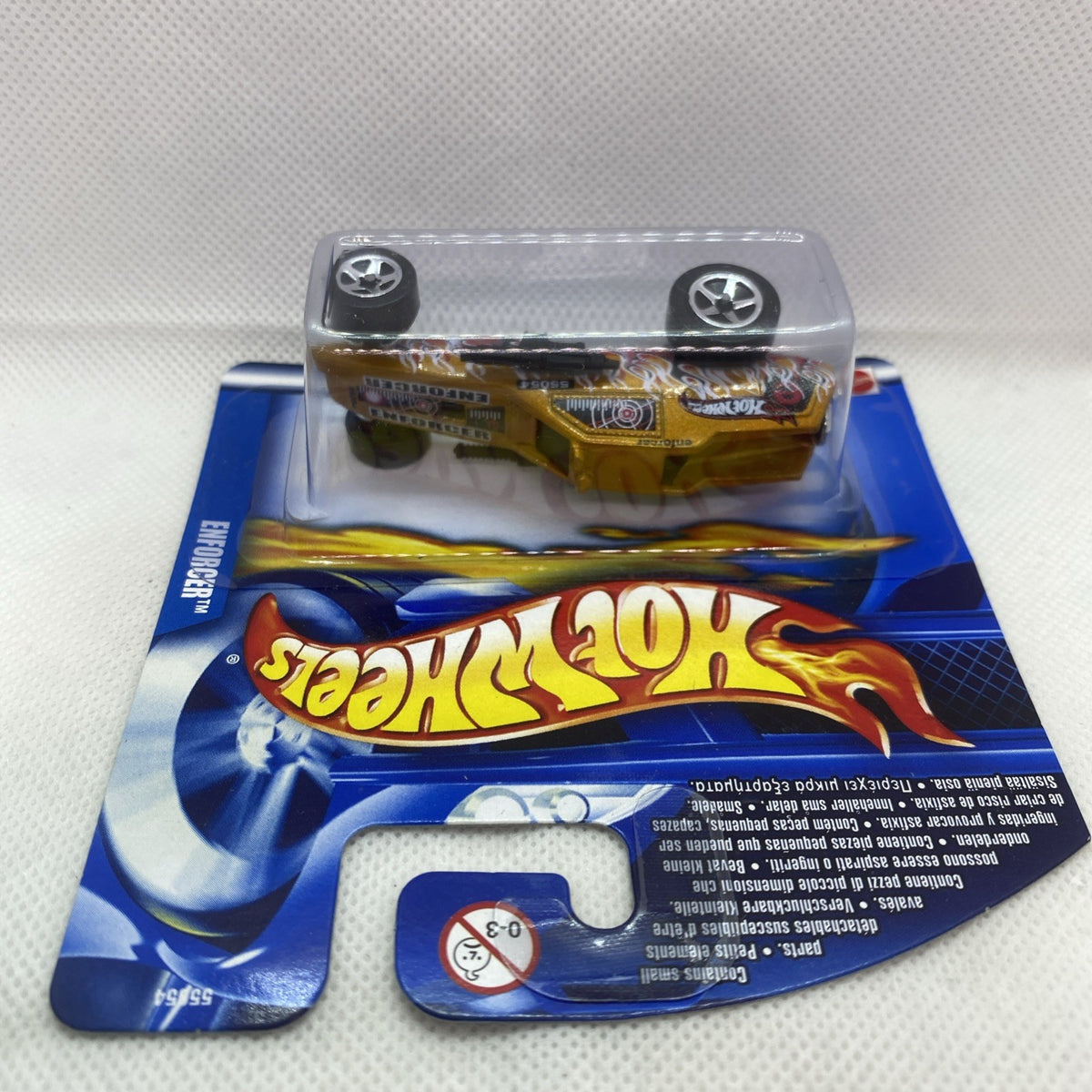 Hot Wheels Enforcer die-cast car blister pack, top view, flame graphics on silver body