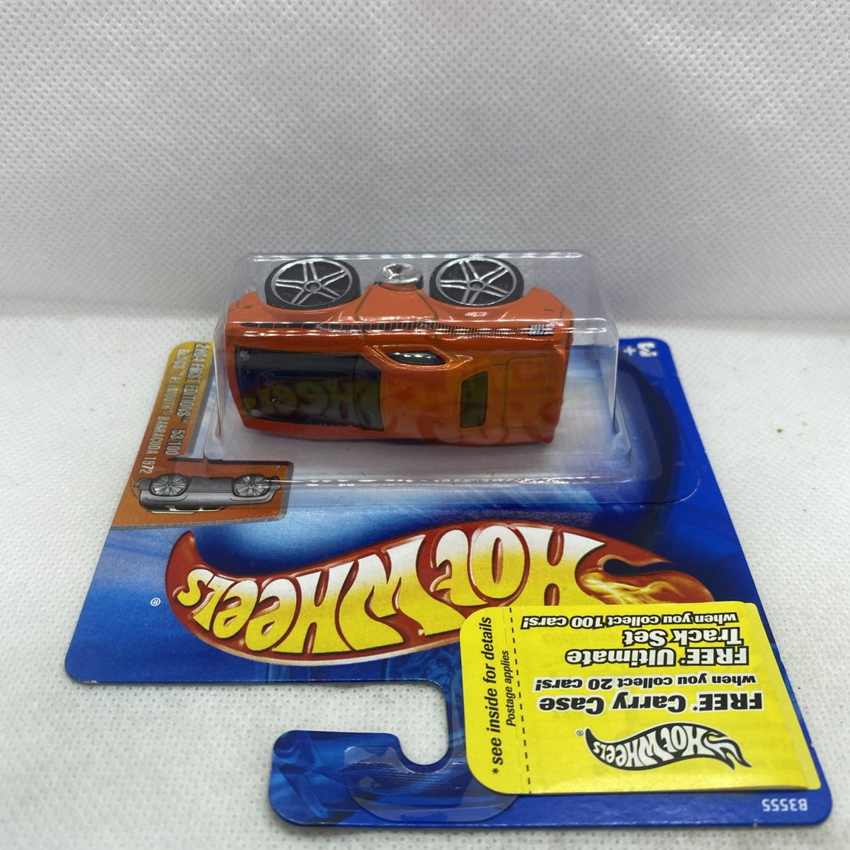 Hot Wheels orange muscle car in clear blister with chrome wheels on blue card