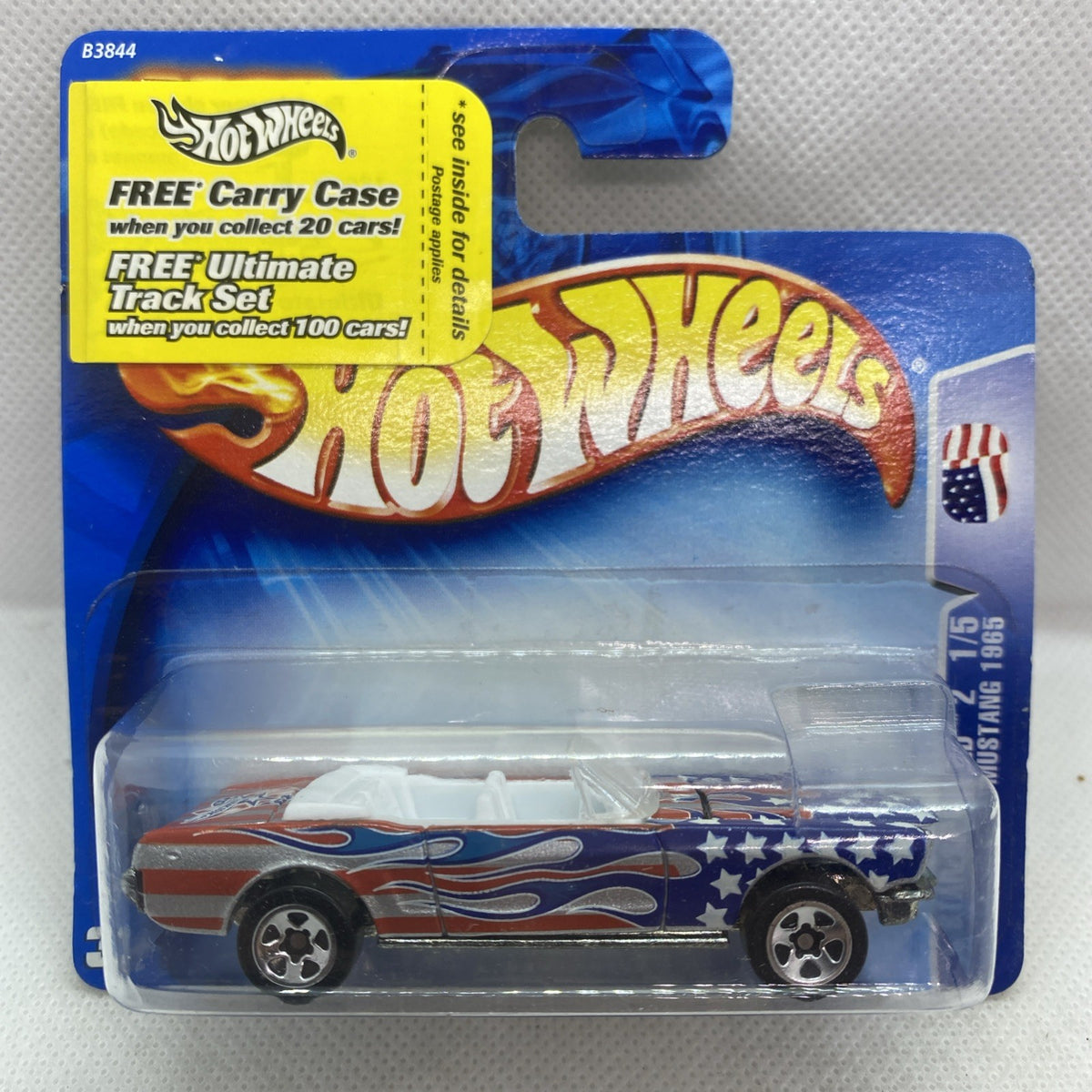 Hot Wheels die-cast Mustang toy car in blister package, American flag flames
