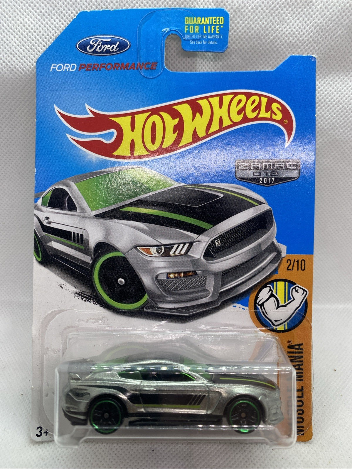 Hot Wheels muscle car blister card with green-and-black Ford Shelby GT350R styling