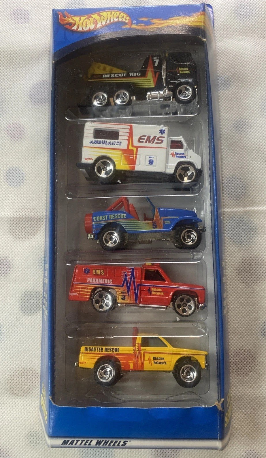 Diecast rescue vehicle 5-pack in retail box with four visible Hot Wheels cars