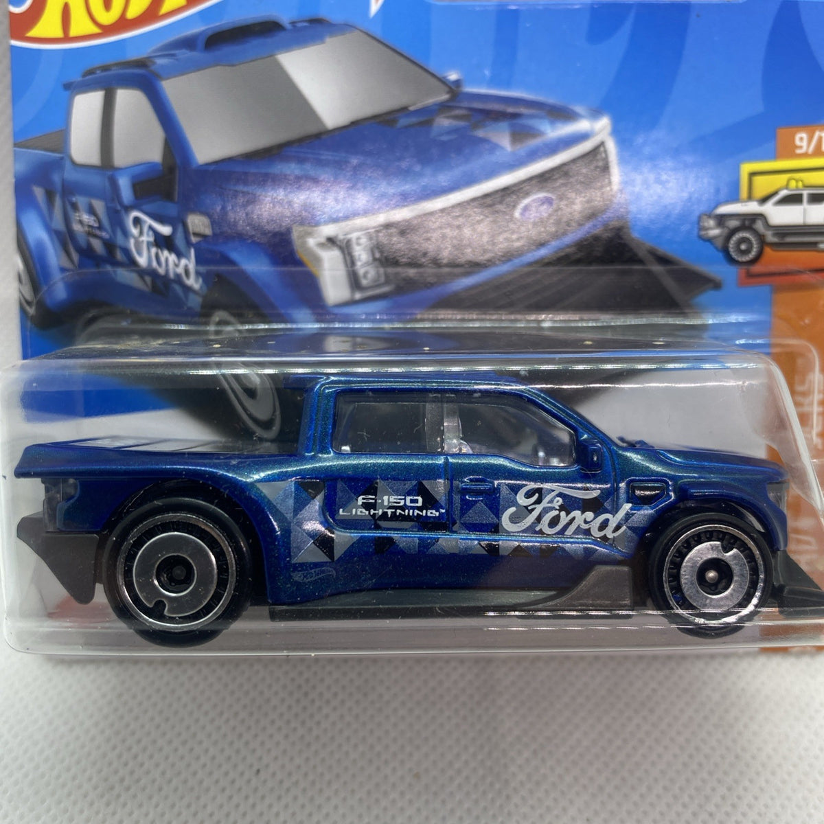 Hot Wheels blue die-cast pickup truck with Ford logo in clear blister