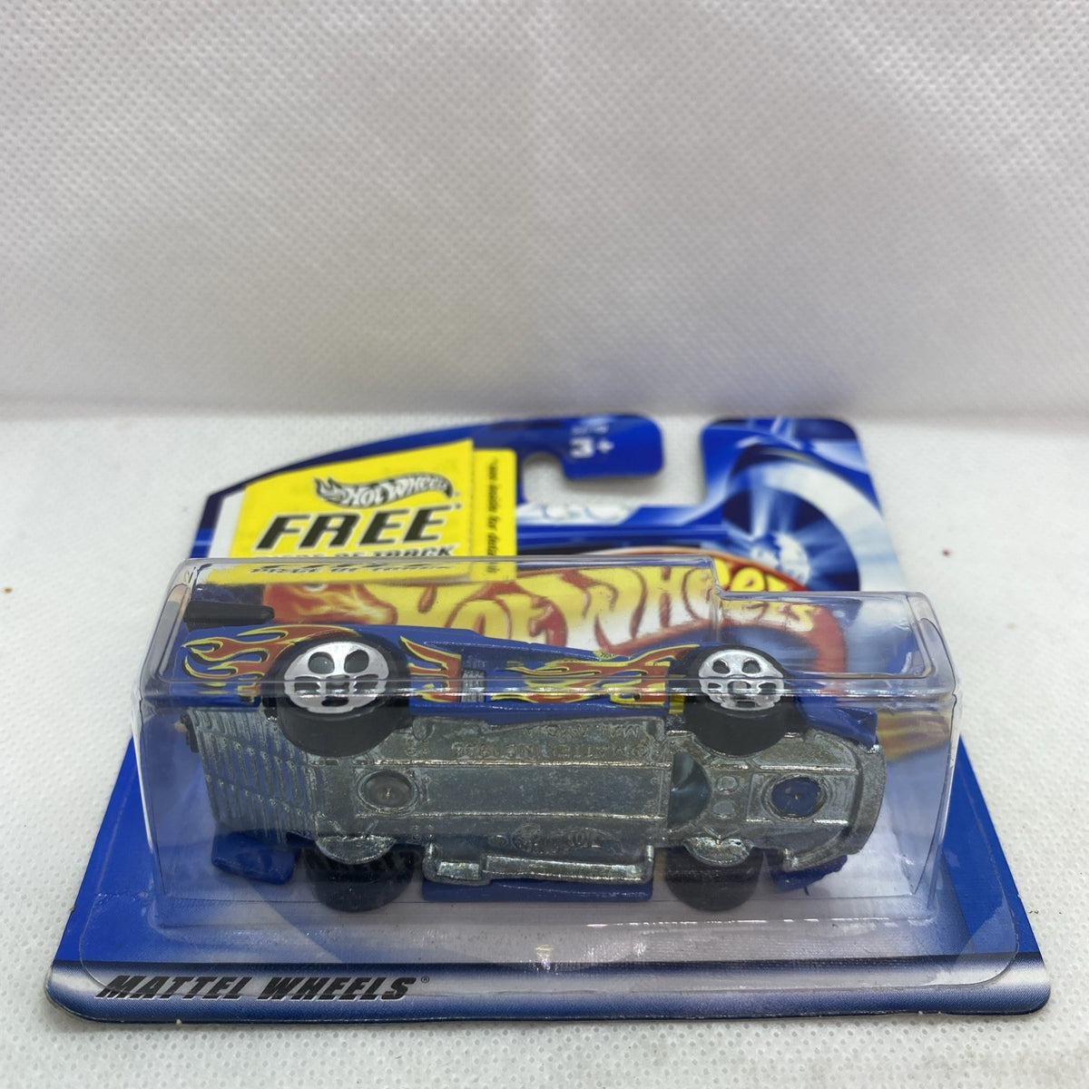 Hot Wheels GT Racer 2001 die-cast car blister, underside view with flame side decals.