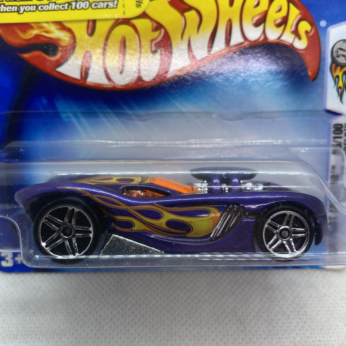 Hot Wheels purple flame die-cast car close-up in clear blister