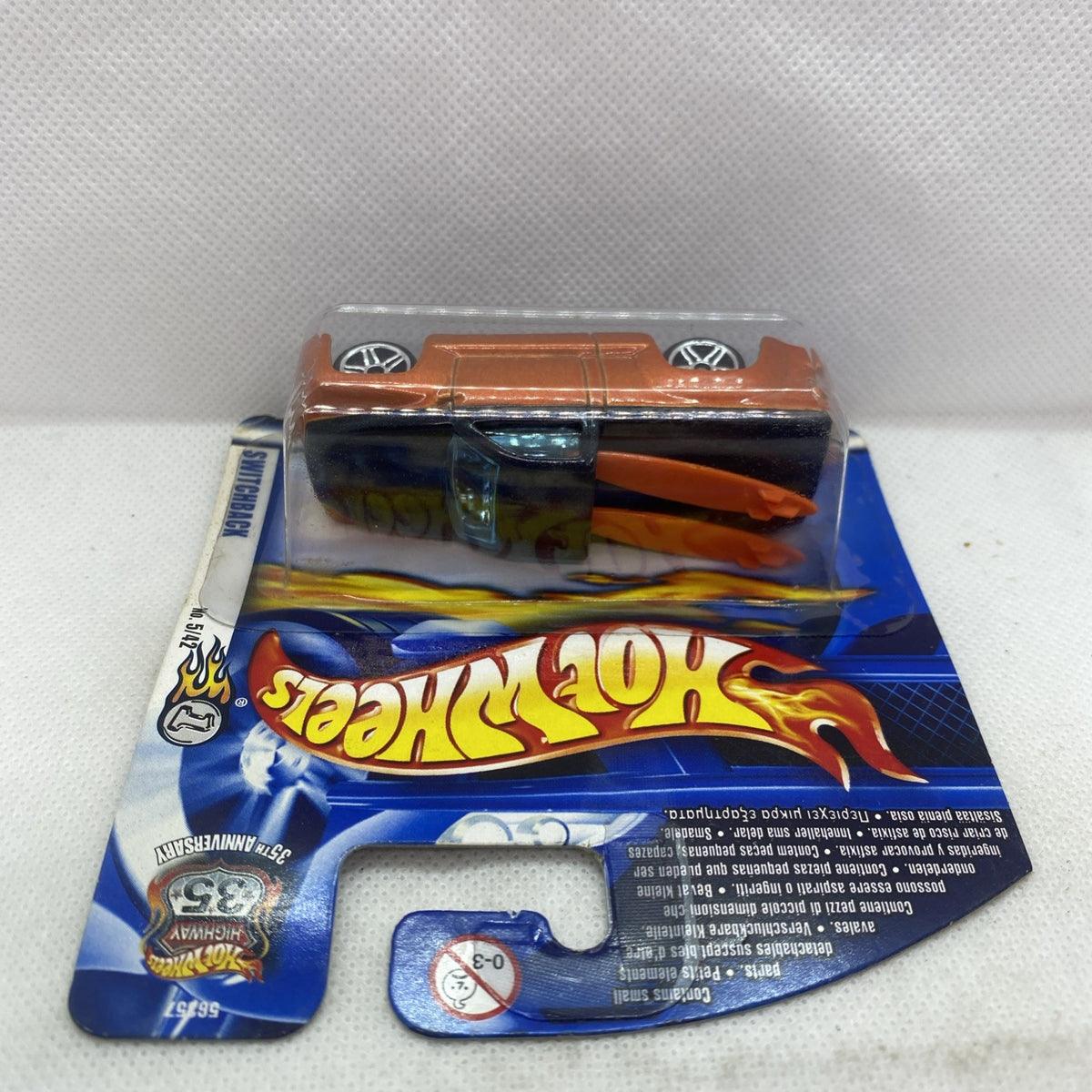 Hot Wheels die-cast car in blister pack, orange top and flame graphic on blue card.