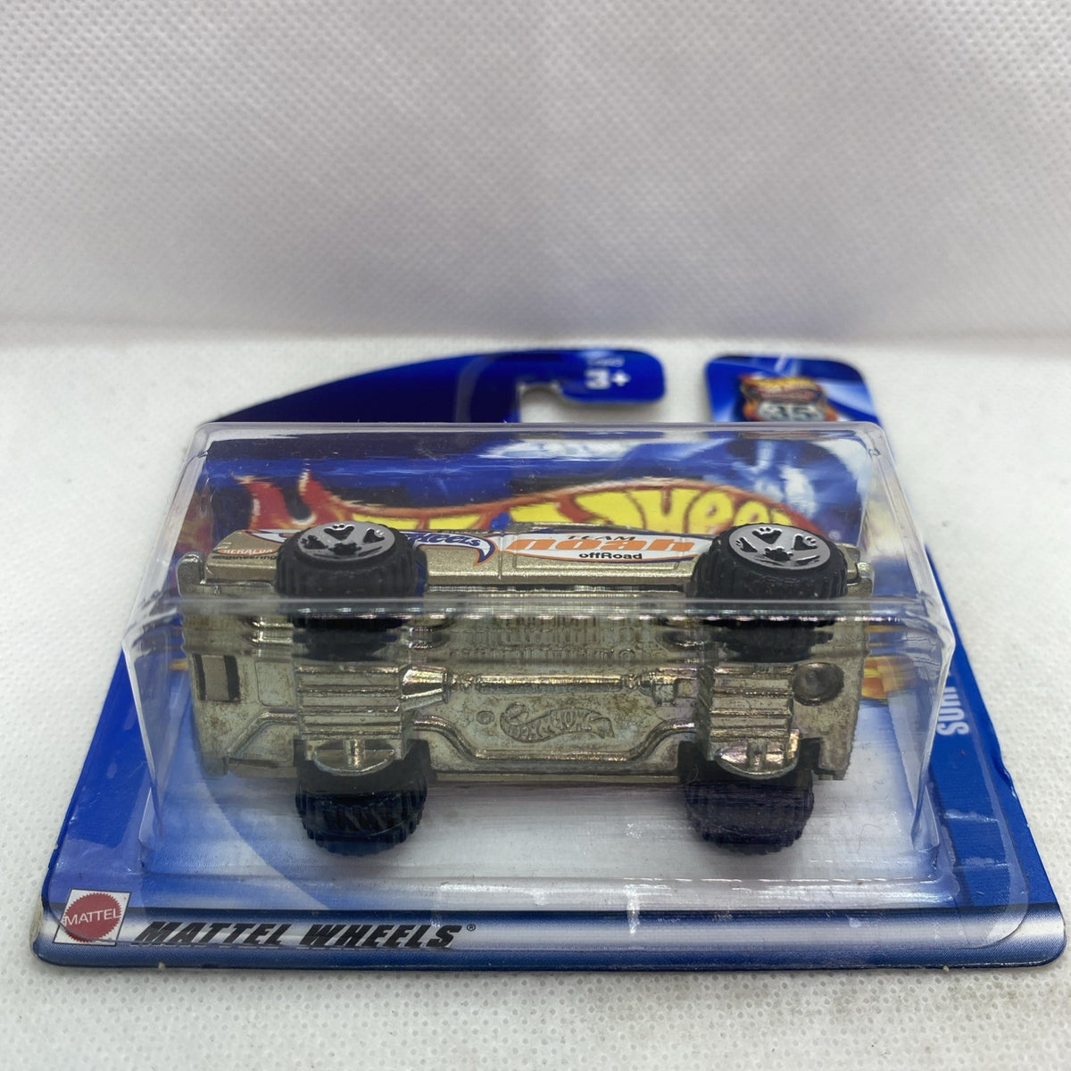 Hot Wheels off-road truck with olive body and black wheels in clear blister