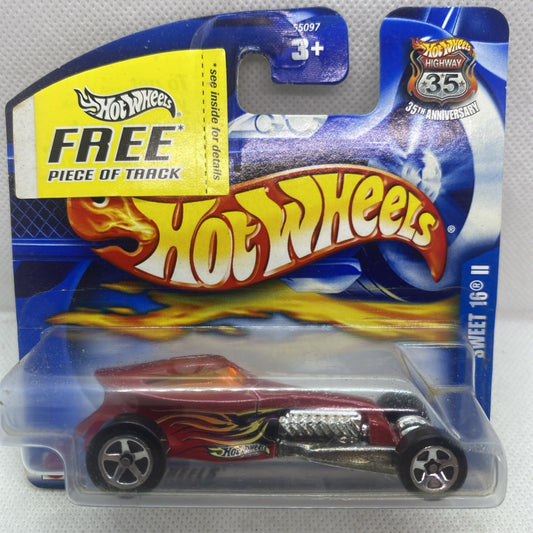 Hot Wheels die-cast car in blue blister card, maroon flame graphics, 3+