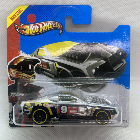 Hot Wheels black and silver diecast race car with yellow accents in retail blister pack