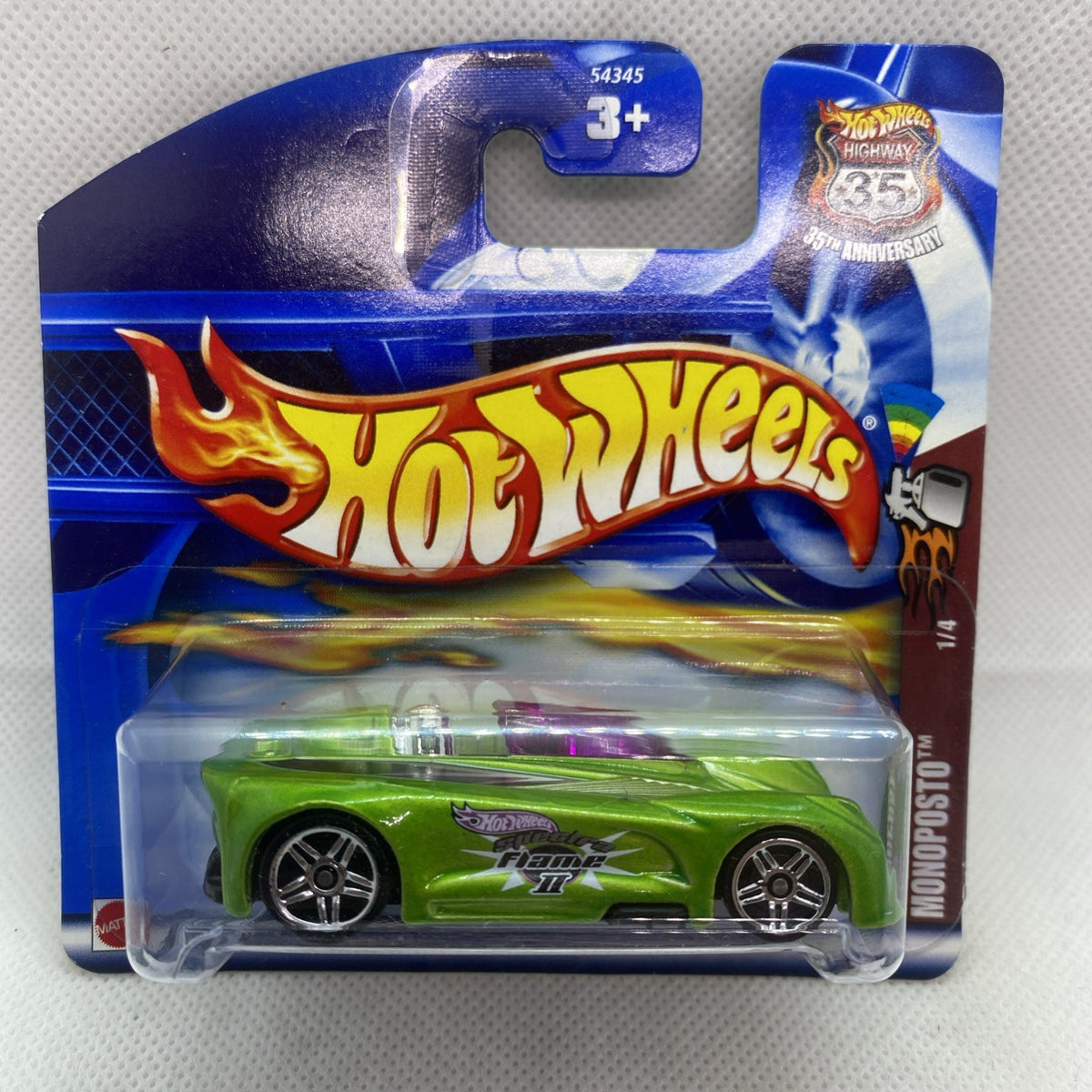 Green race car in clear blister on blue card packaging