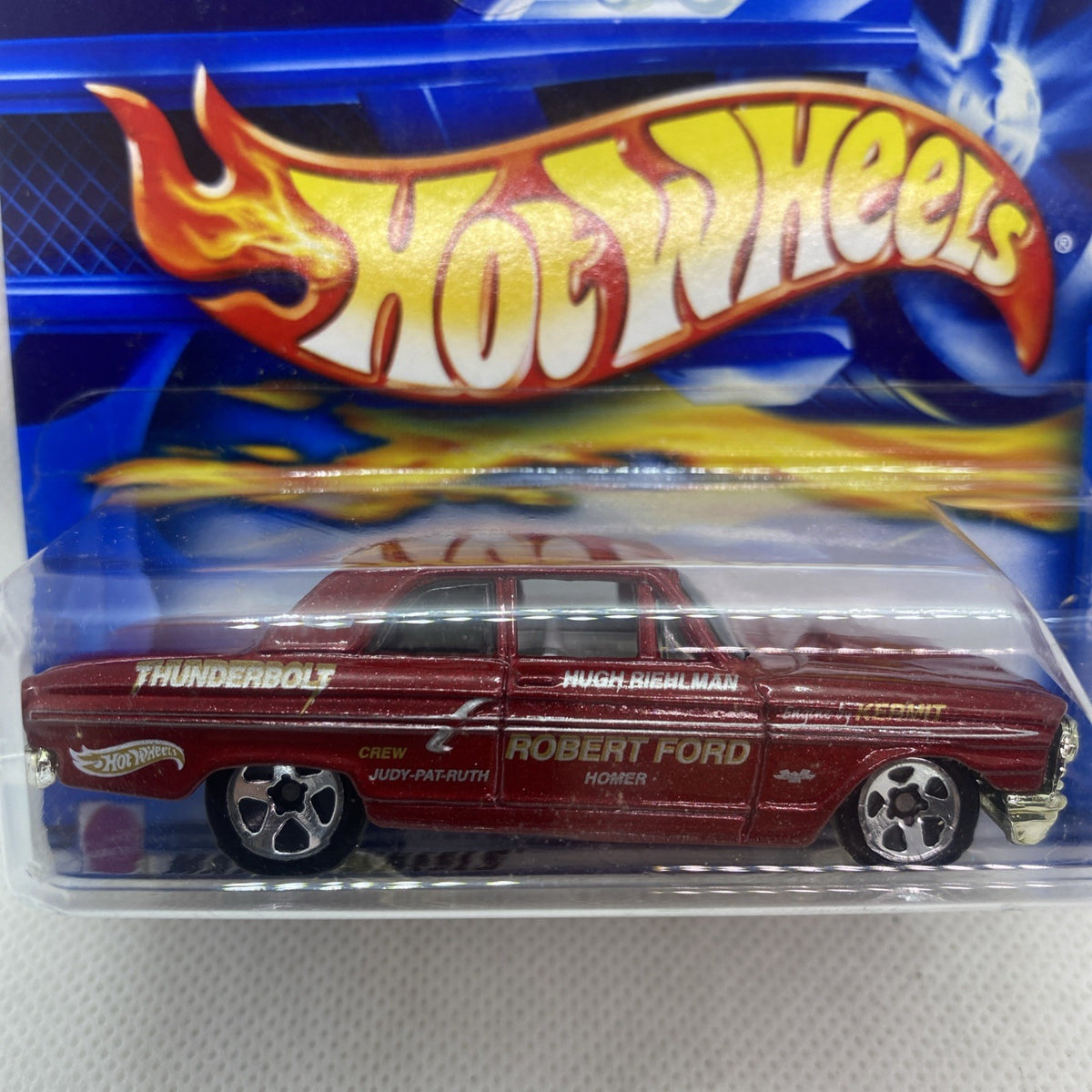Hot Wheels die-cast car in blister pack, maroon Thunderbolt Ford close-up