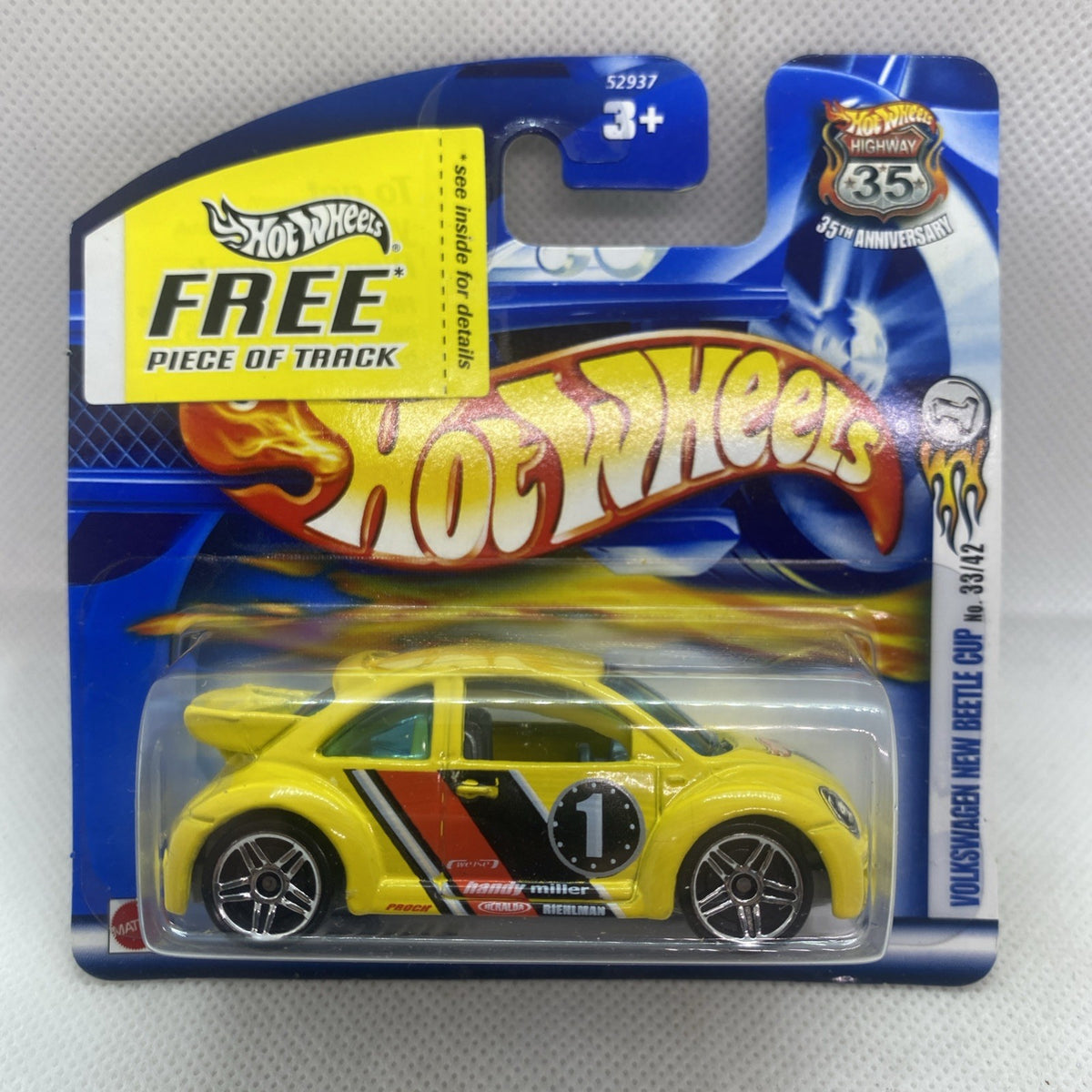 Hot Wheels yellow VW New Beetle die-cast car in blue blister pack, #045