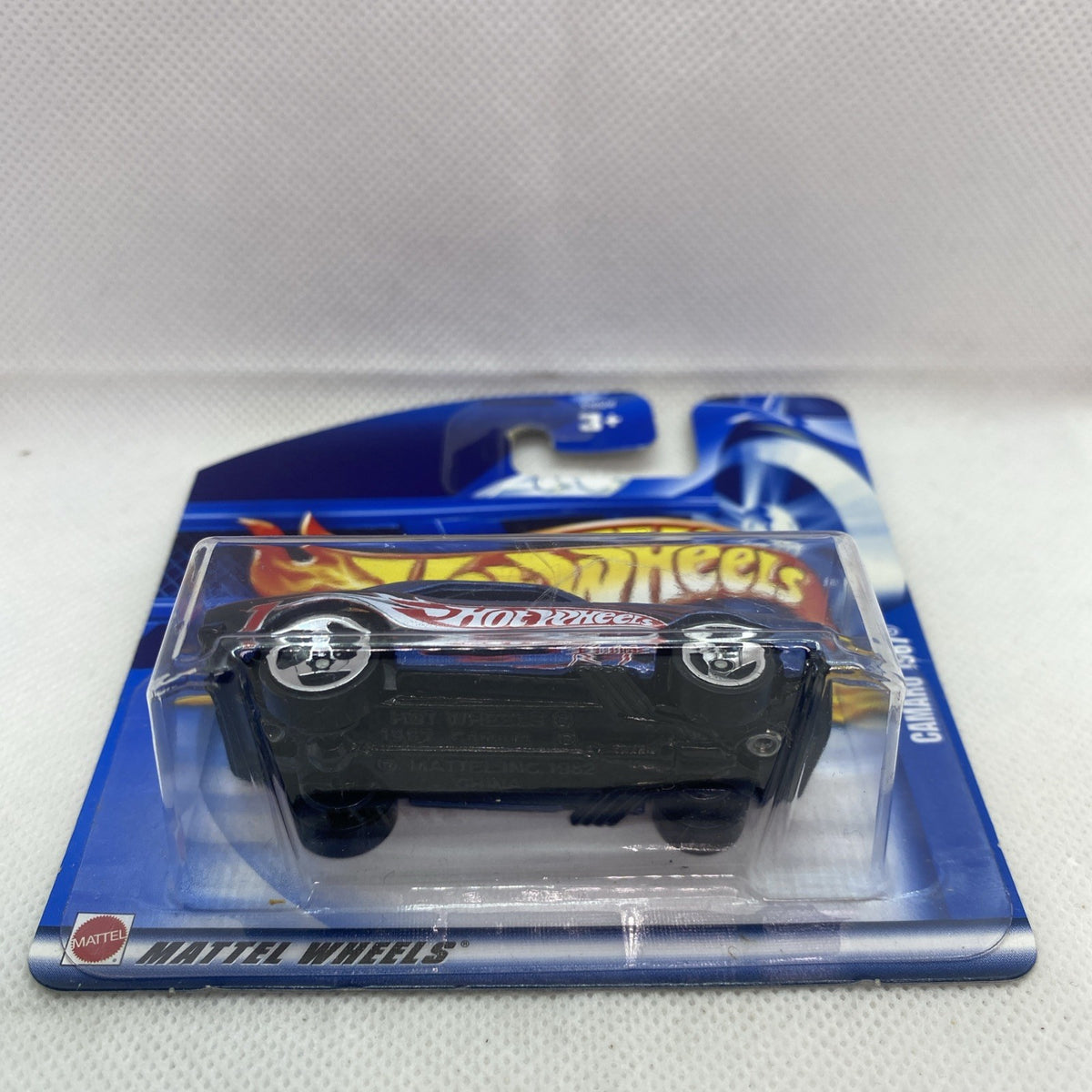 Blue Camaro die-cast toy car in clear blister on Hot Wheels short card, front view
