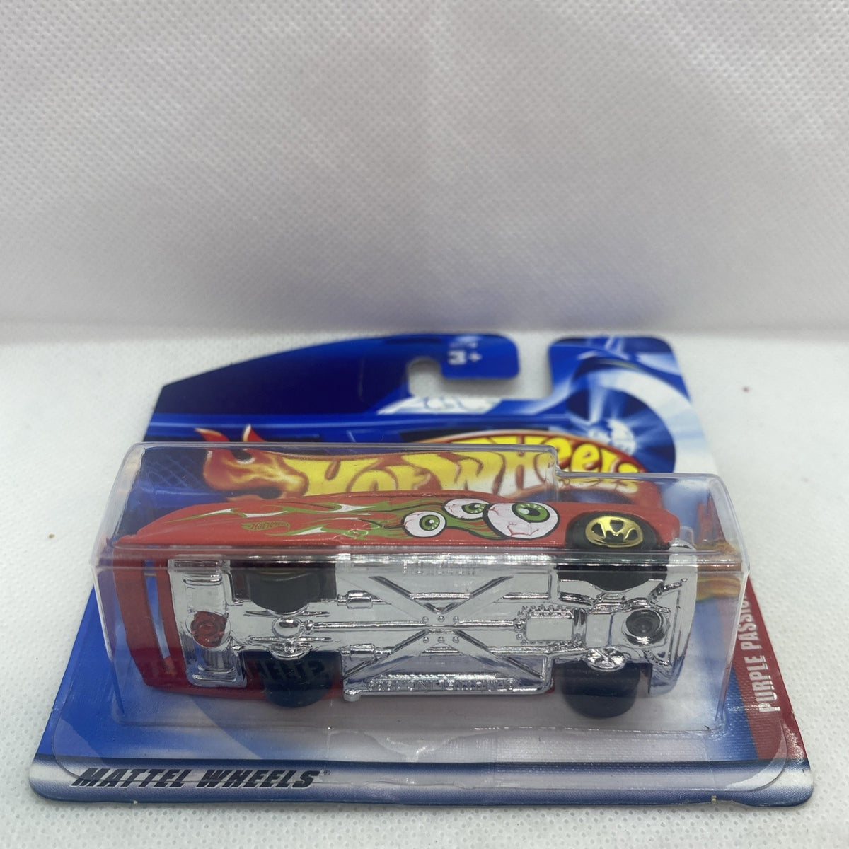 Hot Wheels blister pack with metallic silver toy car, purple passion label on blue card