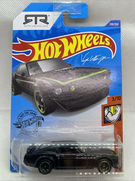 Hot Wheels '69 Ford Mustang Boss 302 die-cast car in blister pack, black with green accents