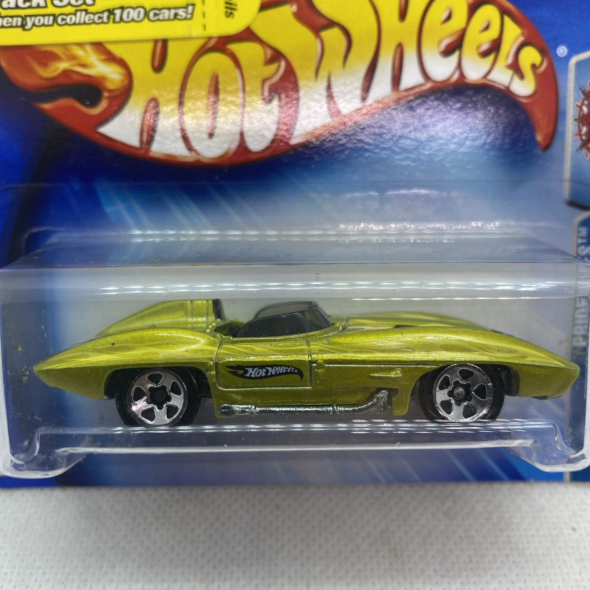 Hot Wheels lime green Corvette Sting Ray die-cast close-up in clear blister