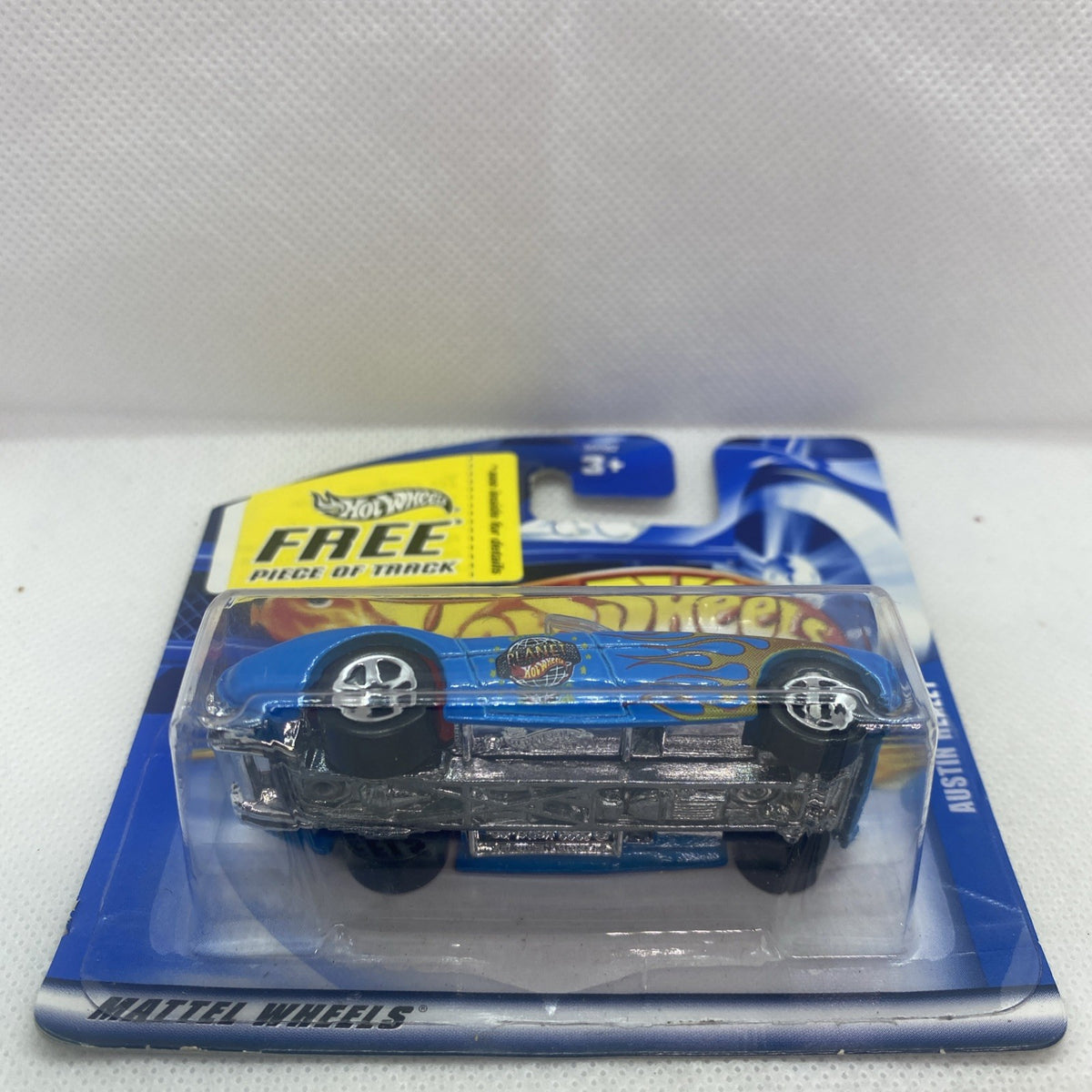 Hot Wheels Austin-Healey 2001 die-cast car in sealed blister pack, side view