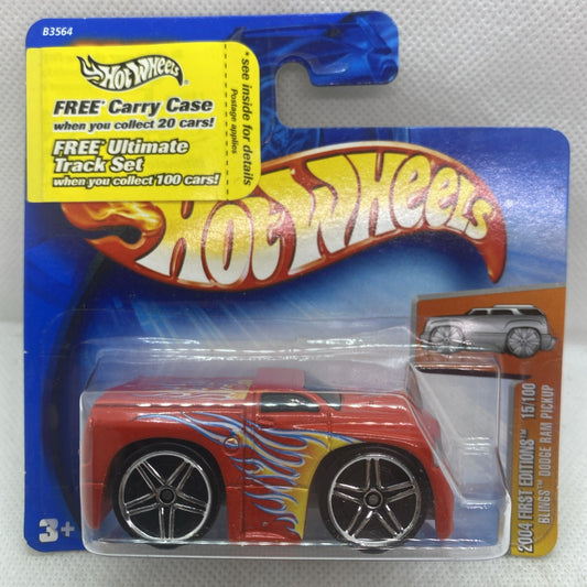 Hot Wheels Dodge Ram 2004 die-cast pickup with orange flame graphics, in blister pack