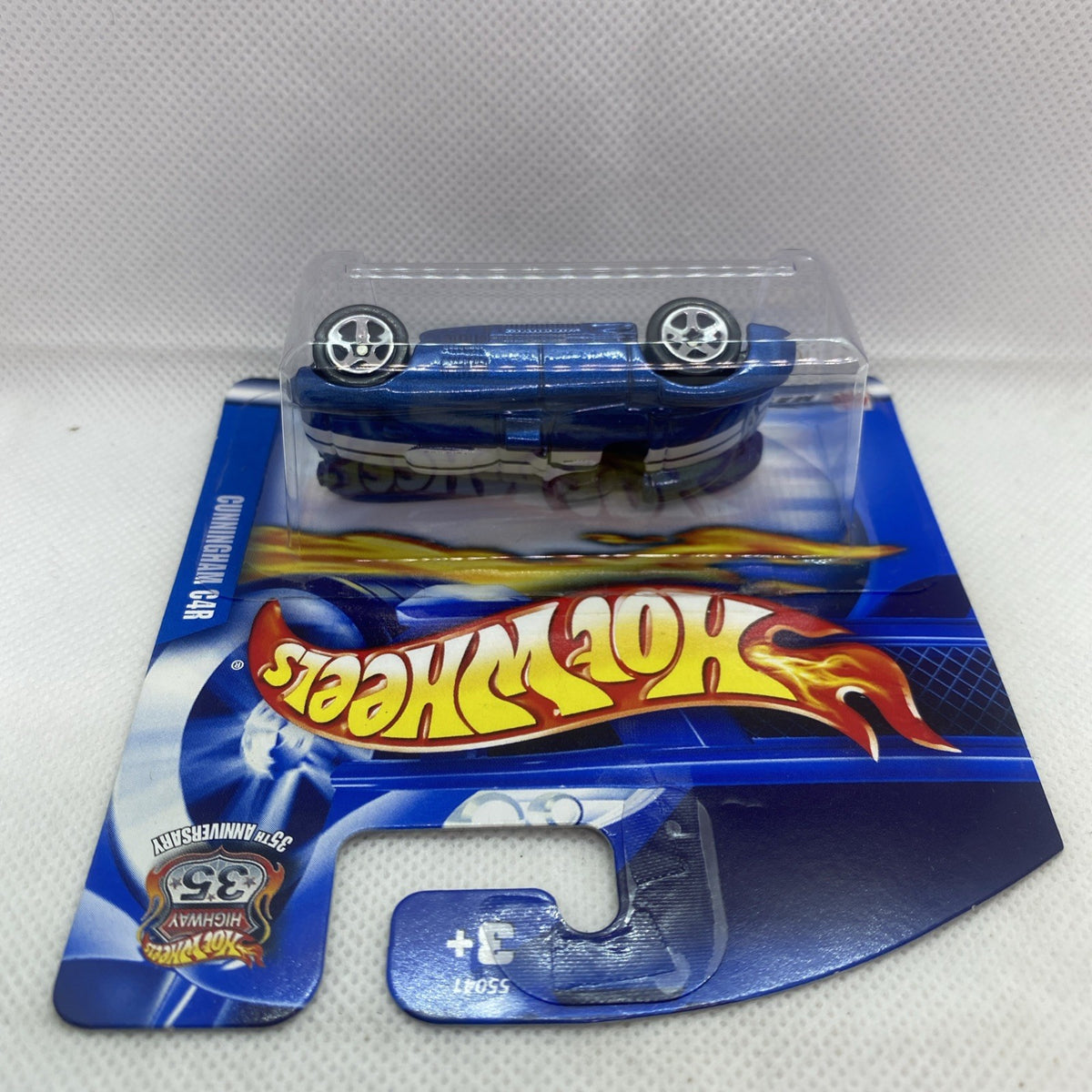 Hot Wheels sealed short card with blue Cunningham C4R model in clear blister