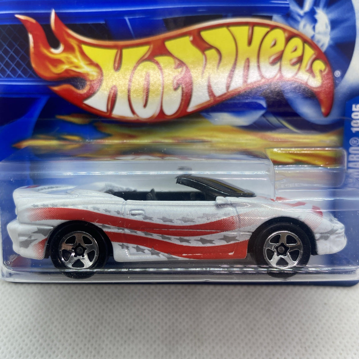 Hot Wheels Camaro convertible close-up in blister, white with red flame decals