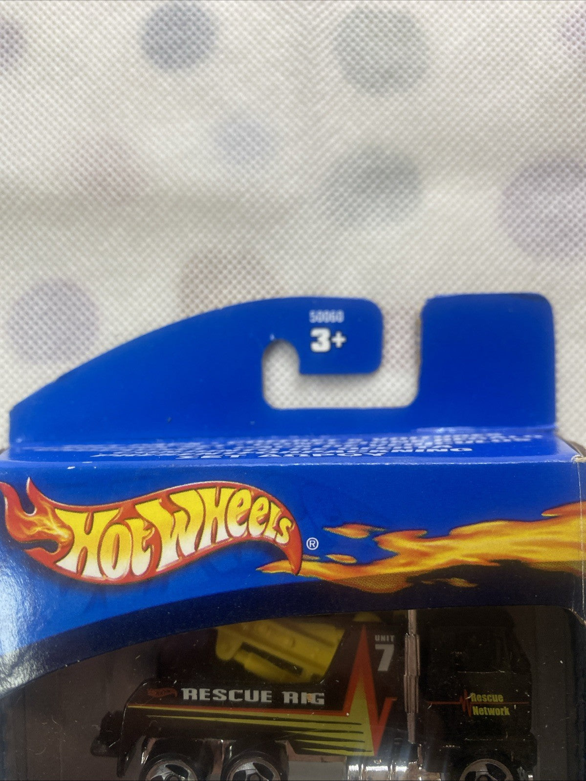 Hot Wheels 5-pack retail box top with flame logo and age 3+ label