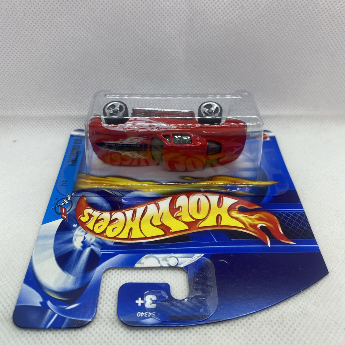 Hot Wheels Corvette die-cast from the side in clear blister on blue card