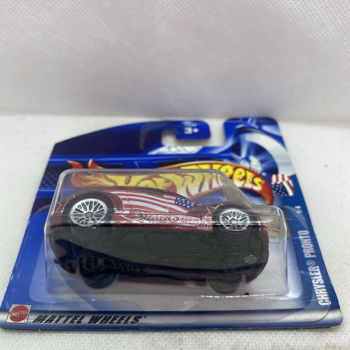 Hot Wheels die-cast car in blister on blue card, maroon body and chrome wheels