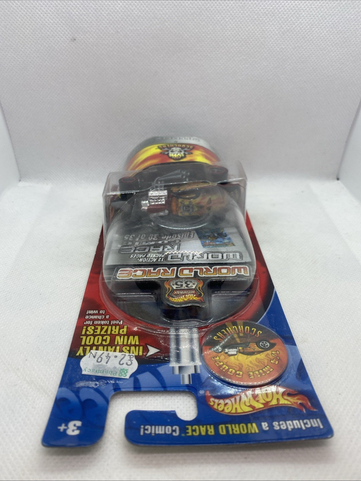 Sealed blister pack showing black Scorchers coupe toy with flame decals and Nitro-X
