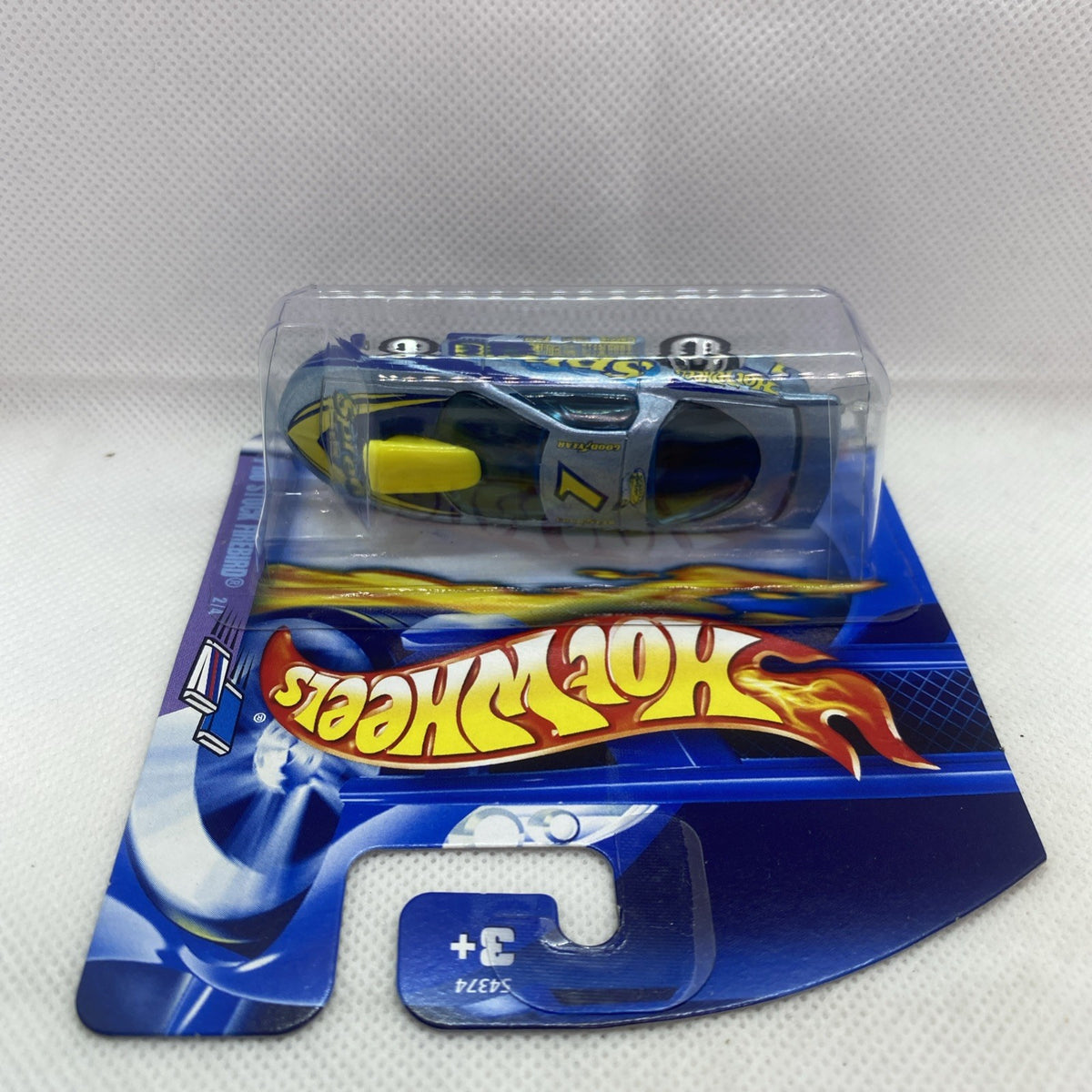 Hot Wheels die-cast car in blister pack, blue body with yellow hood panel