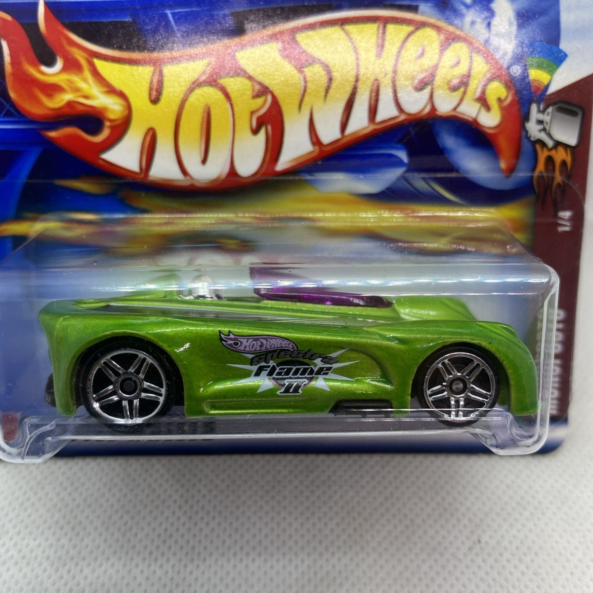 Green race car with chrome wheels in clear blister on Hot Wheels card