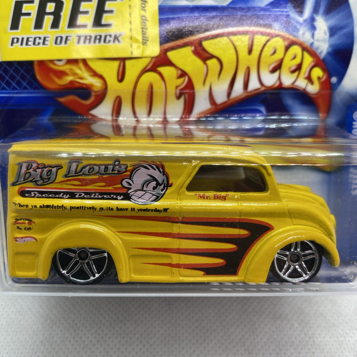 Yellow Hot Wheels pickup in clear blister with Big Lou's logo and flame stripes.