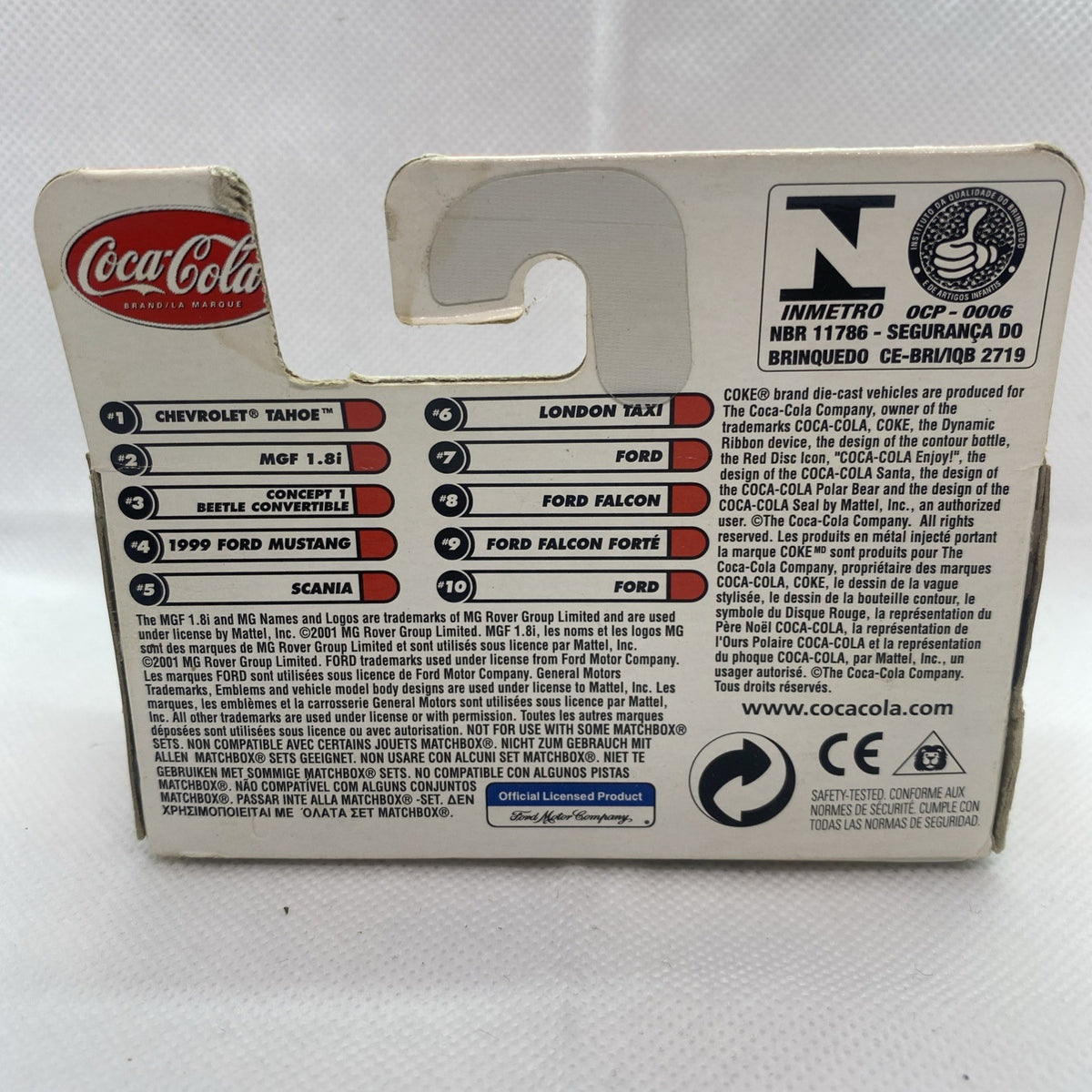Back of boxed die-cast car with stickered wheel names and product information text