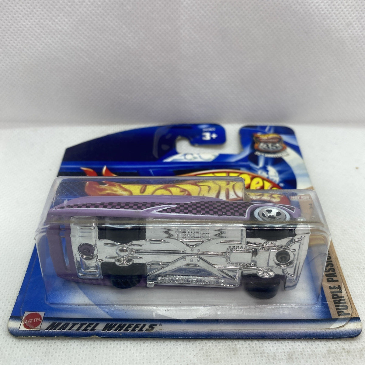 Hot Wheels die-cast car in blister, silver/chrome body with purple packaging card