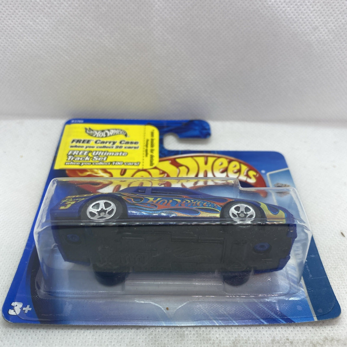 Hot Wheels die-cast car in blister, dark blue body with flame decals and wheels
