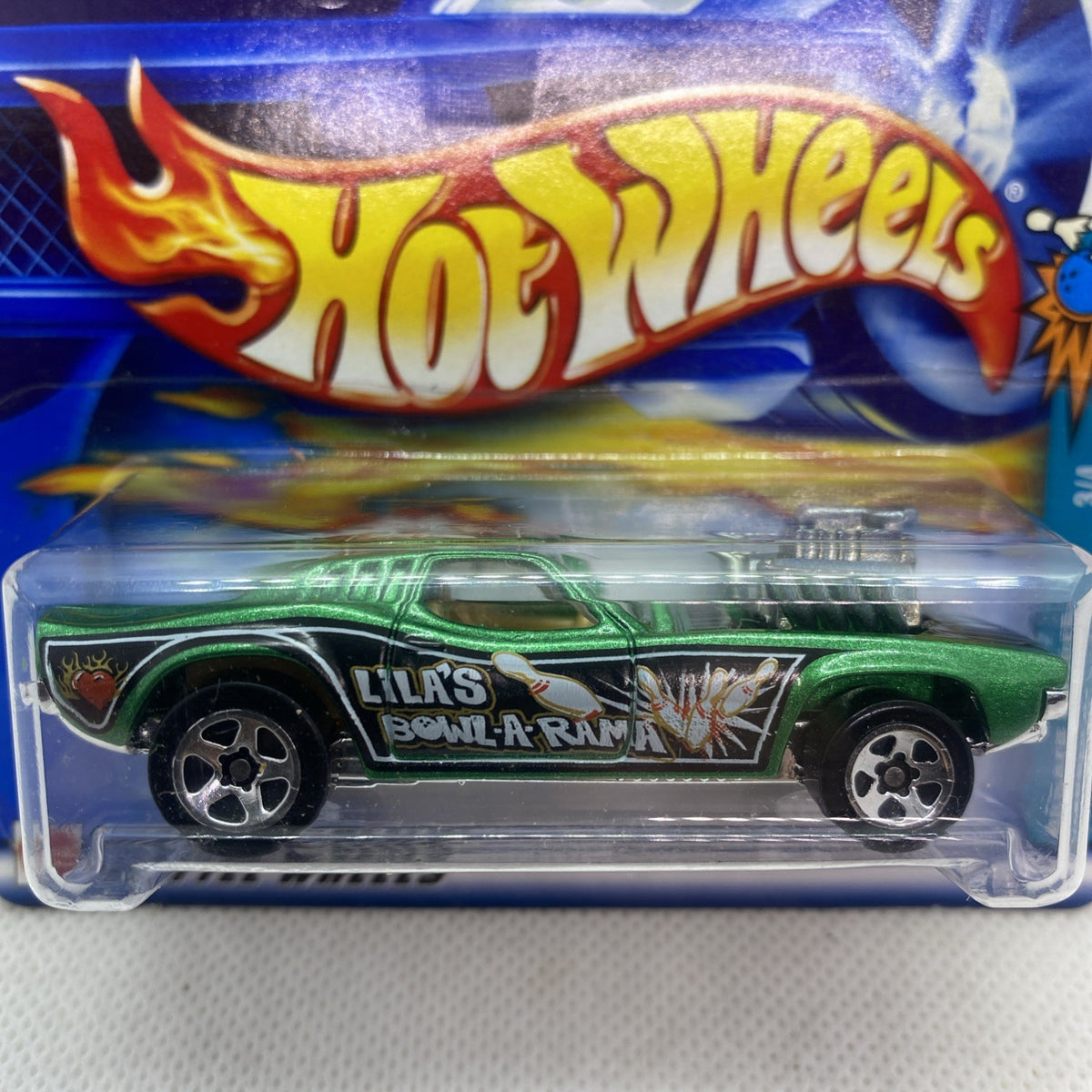 Green Hot Wheels die-cast car in blister with flame graphics and detailed wheels