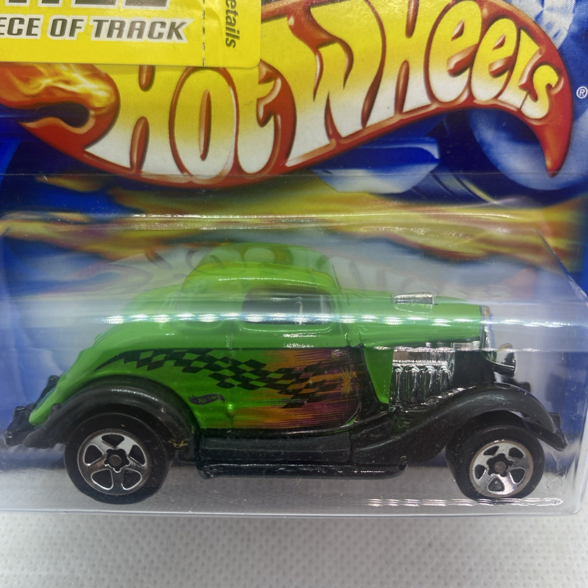 Hot Wheels green '34 Ford die-cast car close-up in clear blister