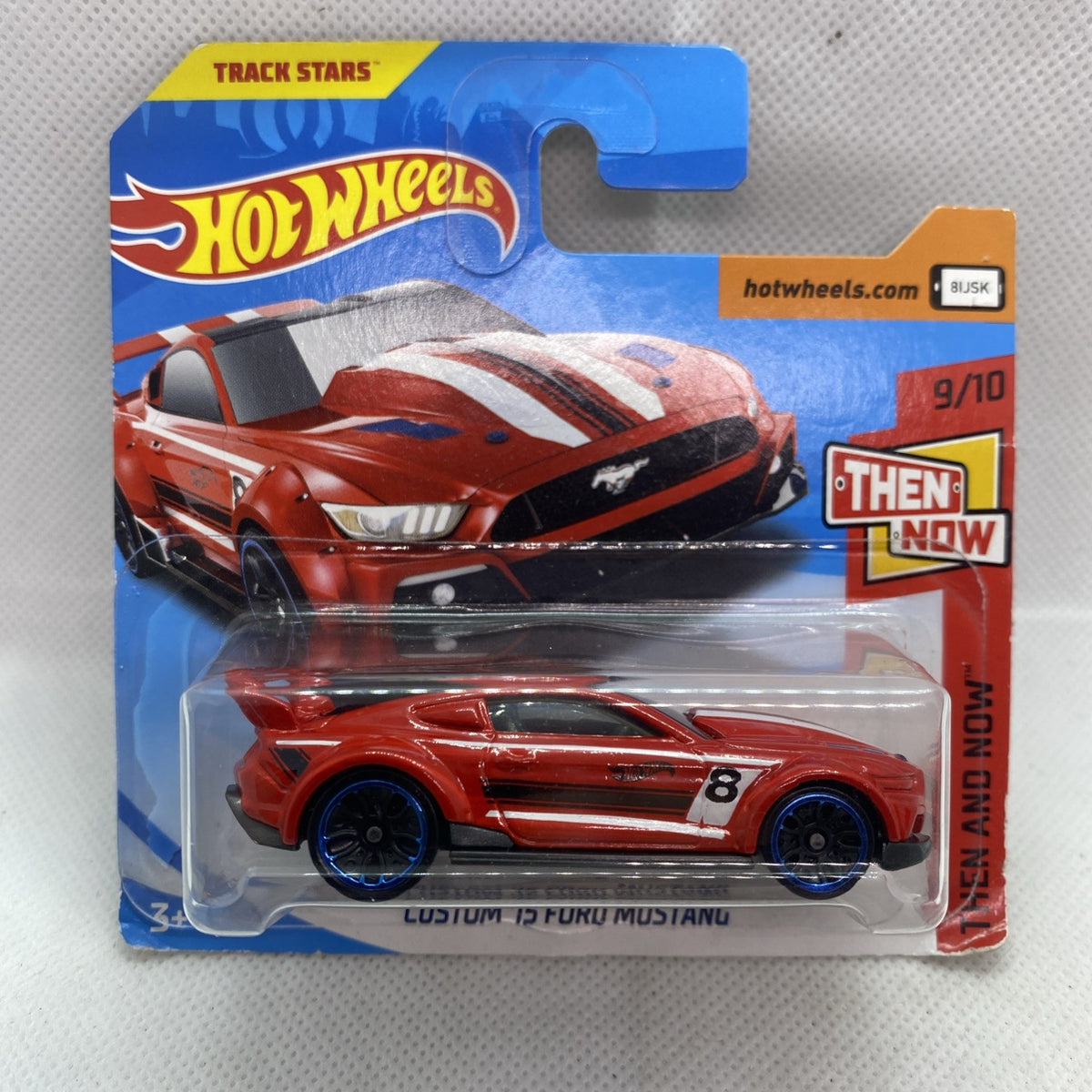 Hot Wheels die-cast Custom '15 Ford Mustang car in blister, red with black stripes