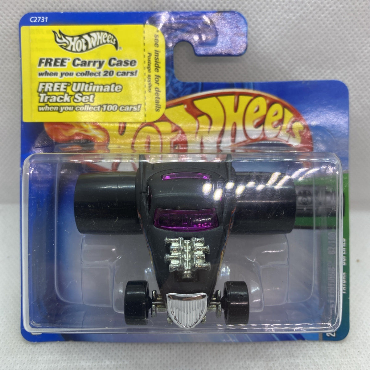 Hot Wheels die-cast car in clear blister pack, black body with purple accents