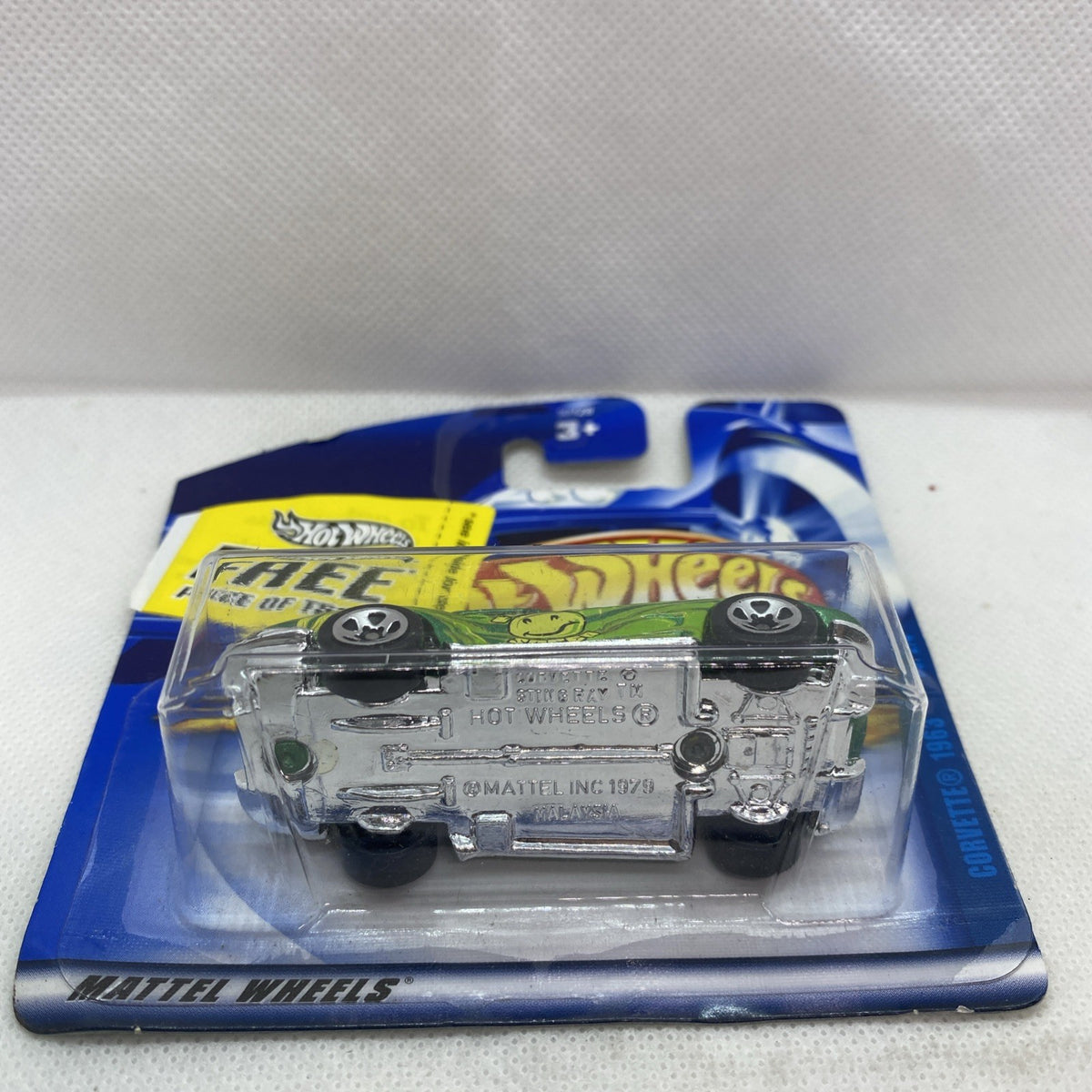 Sealed Hot Wheels die-cast car showing chrome underside in clear blister