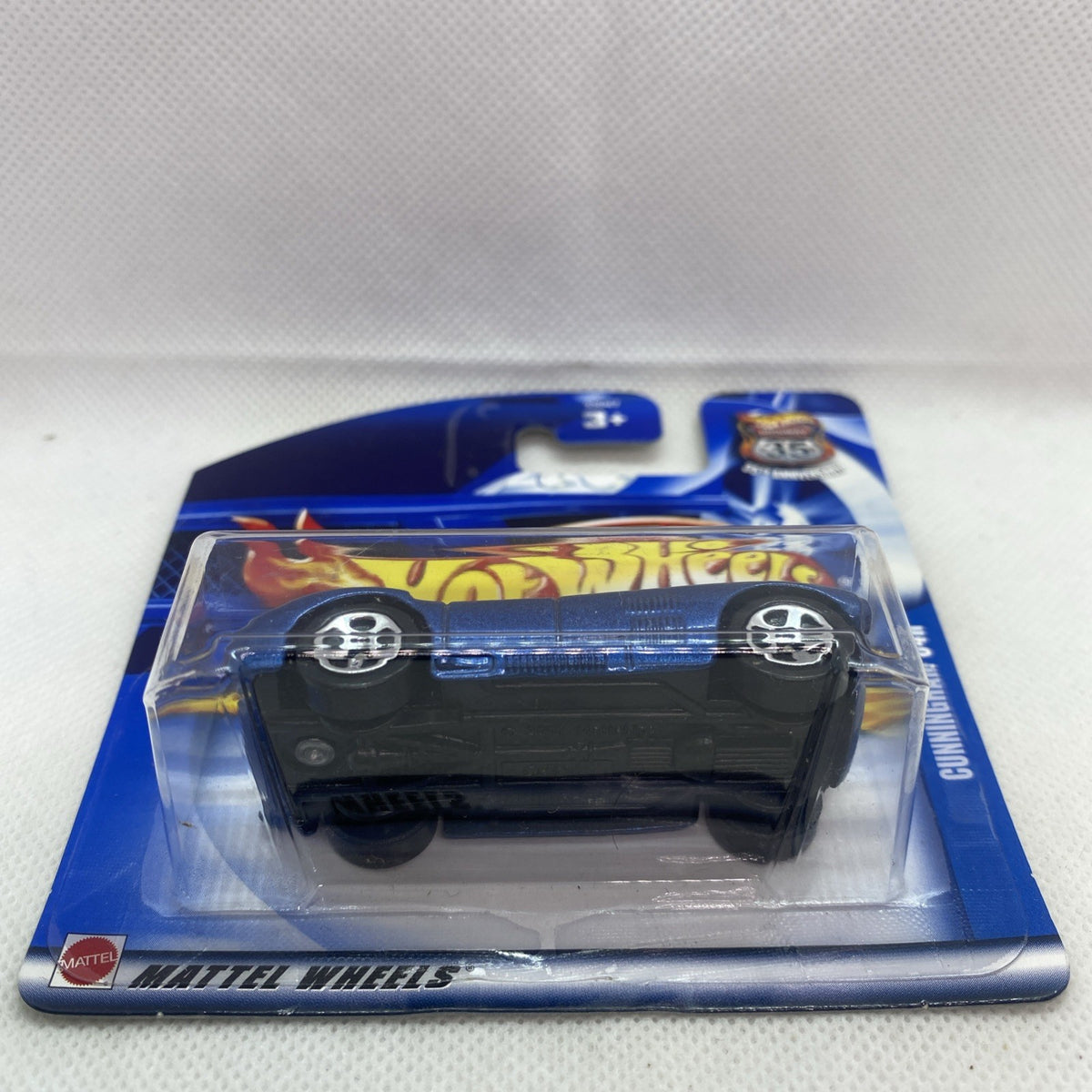 Hot Wheels sealed short card showing top view of blue Cunningham C4R model